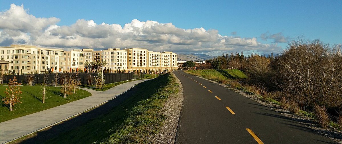 paved riverside trail with trees at Guadalupe River Park San Jose