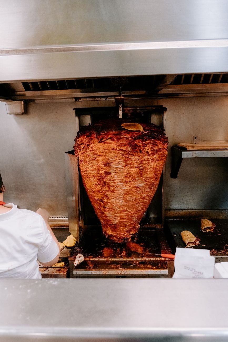 Al pastor cooking on a vertical trompo at an Eastside San Jose taco stand